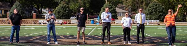 NWU 校友 athletes on the football field being honored.